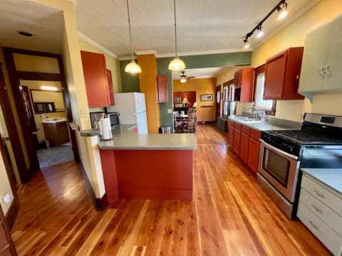View of the full kitchen from the entryway. Tons of natural light and spacious.