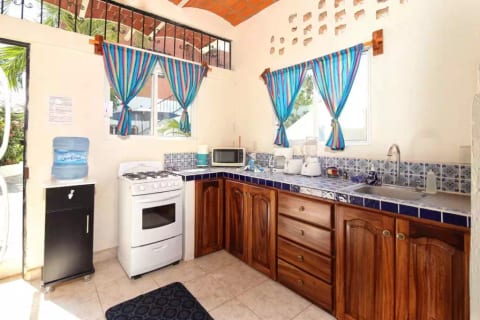 Full kitchen with full sized fridge