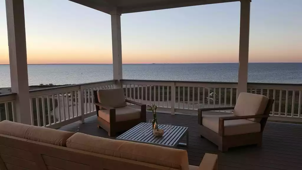 Covered Upper Deck with outdoor sofa set from Restoration Hardware - Heaven on Bay - Galveston