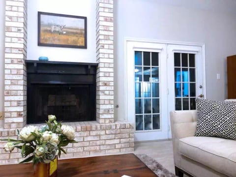 Spacious living room with french doors to garden porch