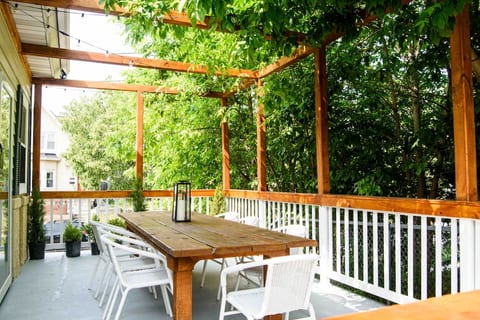 Relax under the pergola, sipping your favorite beverage, talking with family and friends while enjoying the street views below.