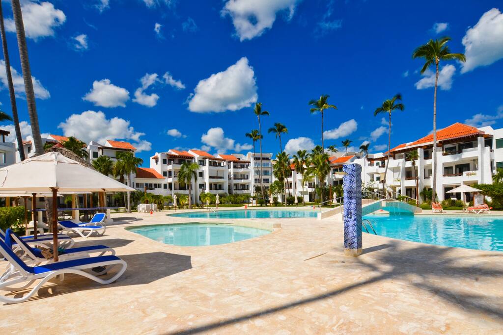 The large pool is scrupulously maintained and there is a separate, shallow pool for smaller children. Umbrellas and loungers surround the pool, and a bar/restaurant offers reasonably priced beverages, snacks and food. - Luxury Condo with Stunning views, Private Beach - Punta Cana