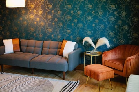 Stylish living room with 55” Roku TV.