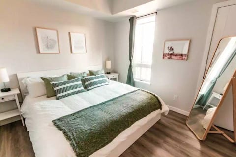 The master bedroom has a king-sized bed and accesses the washroom via a walk-through closet. This south facing bedroom has a blackout curtain for those early bright mornings! 
Conveniently charge your devices using the USB plugs in the lamps.