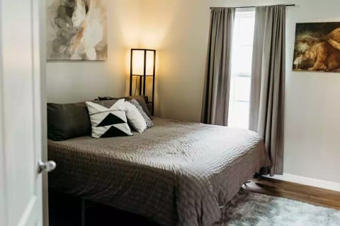 Jumping down to the lower floor, the second suite features a king bed with memory foam mattress.