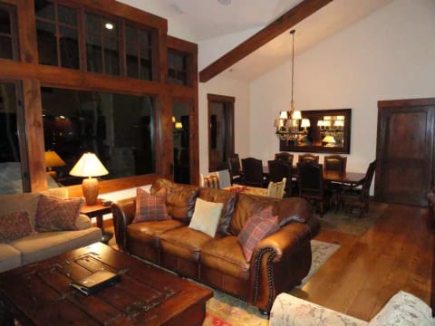 Open floor great room with high, beamed ceilings and huge unobstructed windows!