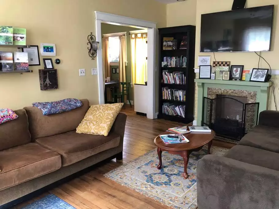 Comfortable living room with two couches and a large Roku TV with Netflix and more. - Cottage West - Central Location Close & Convenient - Kansas City