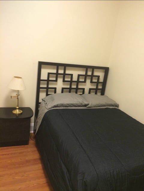 The queen size bed in the private bedroom 