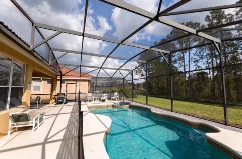 Lanai with outdoor dining area, and south-facing pool deck