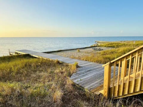 Steps to the water, pier ladder, and a firepit!