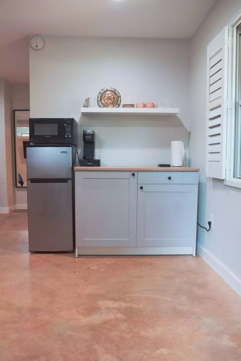 Kitchenette provides the essentials: coffee maker, microwave, mini fridge, kettle, toaster oven and more.
