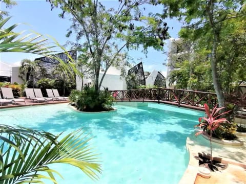 Pool View. This swimming pool is located just across our condo. Here you can enjoy swimming and sun bathing.