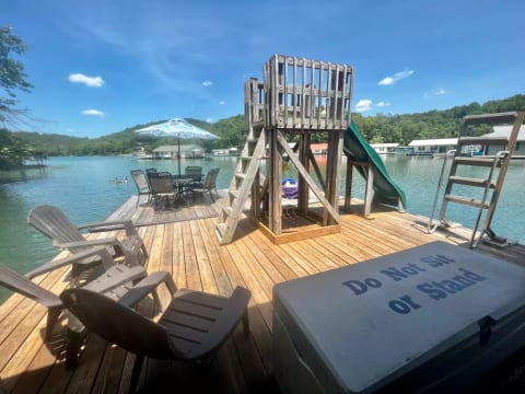 Large swim platform with slide and easy out ladder