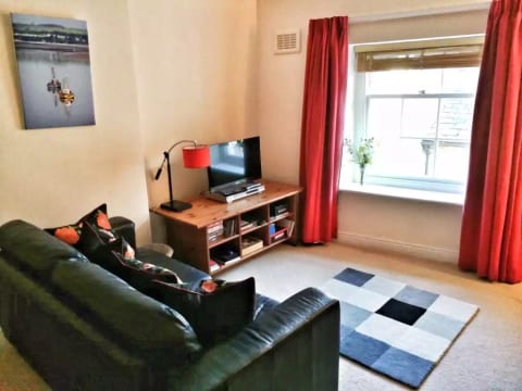 Lounge - with a couple of sofas, space to relax, and read a book from our collection, or watch a DVD?