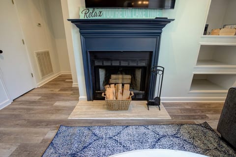 Unwind around the cozy fireplace while watching Netflix and live TV on the 55" flatscreen TV