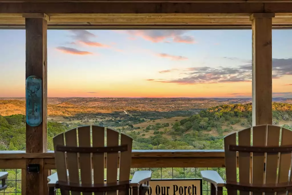 This view can not be captured in a picture!  The view is absolutely AMAZING!  Relax on our covered porch in the most comfortable polywood glider chairs and take in the morning sunrise.  You won't be disappointed! - GWR-Private-AmazingHilltopView-HotTub-FirePit-Pool - Fredericksburg