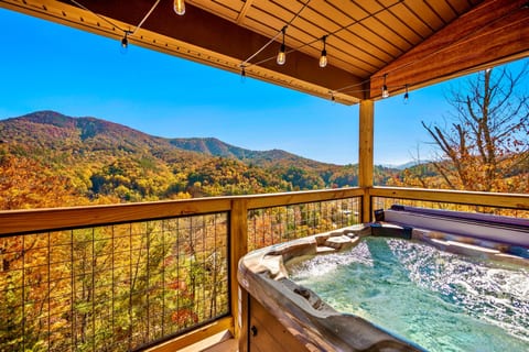Relax and unwind in your own private hot tub while marveling at the stunning panoramic mountain views.