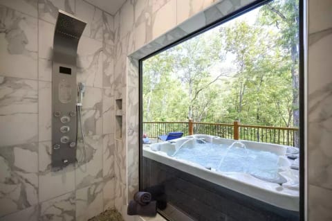 Rainfall spa shower system, window has privacy shower curtain, not shown here. 