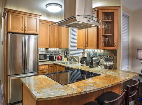 Newly remodeled kitchen with all stainless steel appliances stocked with all necessary appliances and utensils