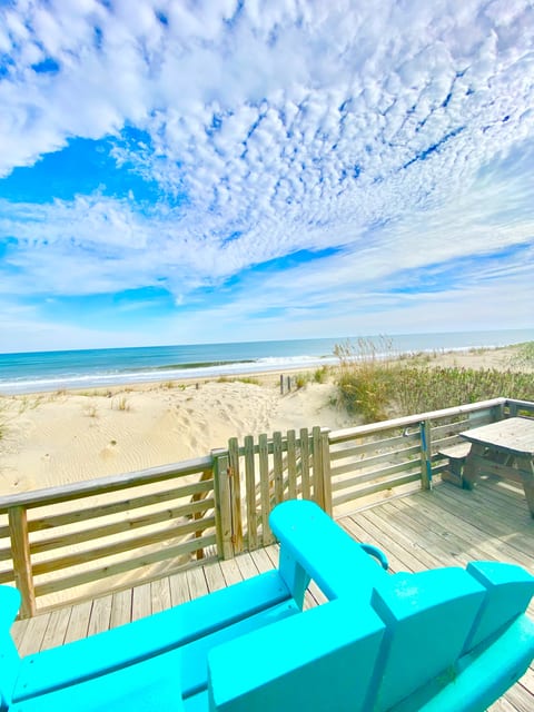 Walk off the deck steps directly onto the beach