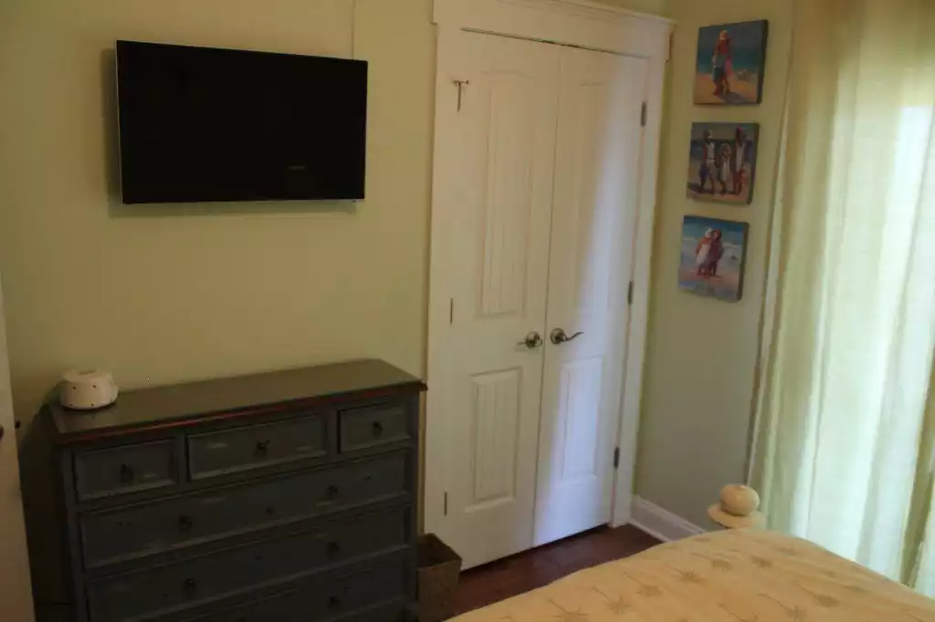 1st floor queen bedroom showing 32-inch flat screen TV. - Pearl by the Sea - North Topsail Beach