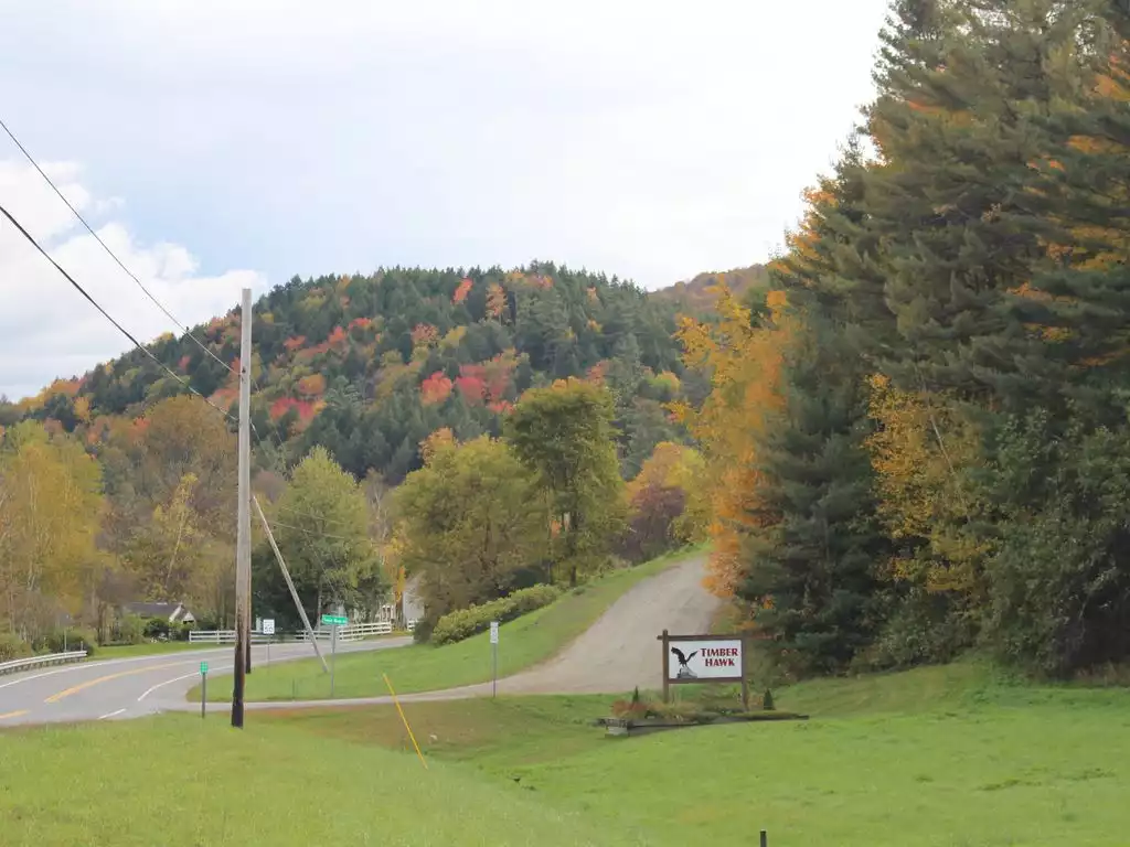 Entrance to Timber Hawk community off Route 100.   Shown at start of fall. - The Crooked House - Stockbridge