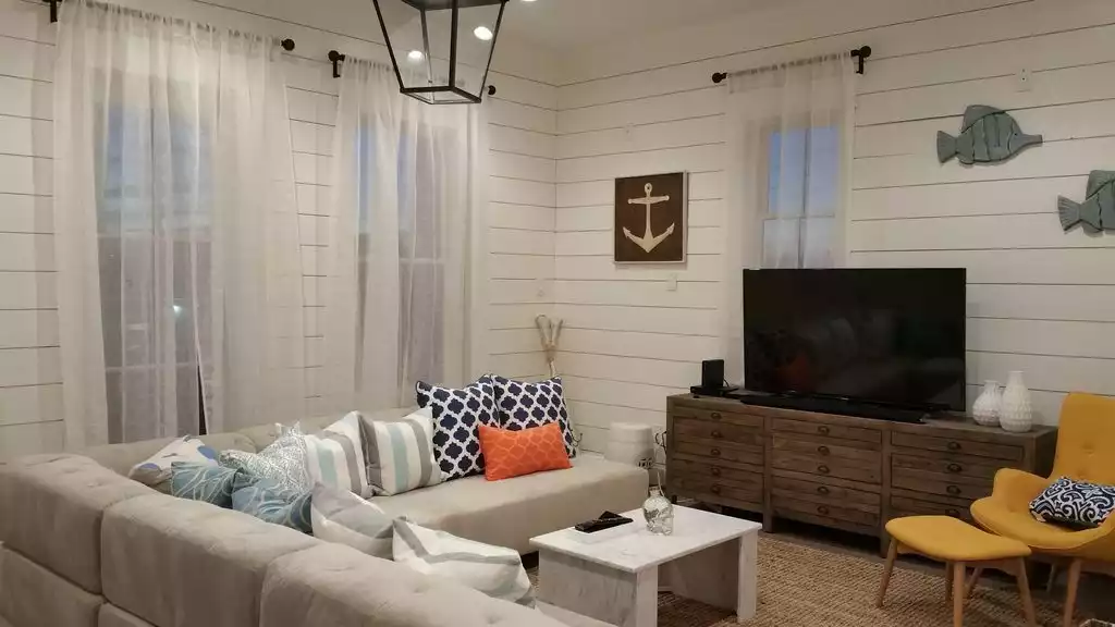 Living area with smart TV, DVD, and sound bar system. - SeaGlass@Beachtown - Galveston