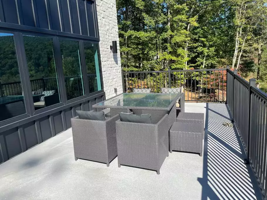 Our square table on the balcony can seat up to 8...the ottomans double as seats. If that's not enough space, there's a huge picnic table out back on the patio too! - Brand new! Modern home with cabin vibes next to Bedford Springs Resort - Bedford