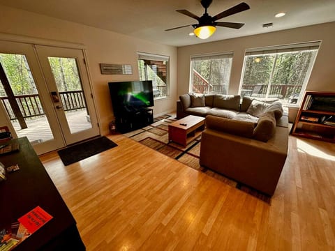 Living Room - Very cozy couch, amazing view, and large TV.
