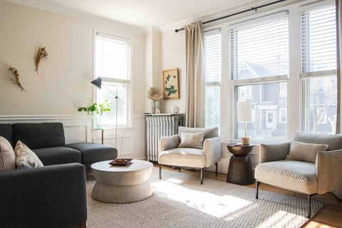 Enjoy the expansive windows in this sun drenched living room, watching your favorite show or catching up with old friends.