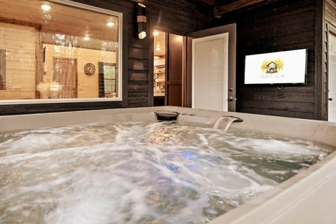 Stream your favorite show and unwind in our outdoor, jetted hot tub.