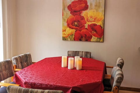 Dining table in between kitchen and deck