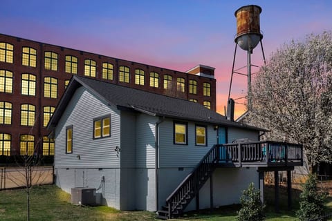 West Village Lofts in the background. This building was one of Greenville's textile mills and has been converted into luxury apartments. At one time these buildings produced more textiles than any place in the world, and Shoeless Joe worked here!
