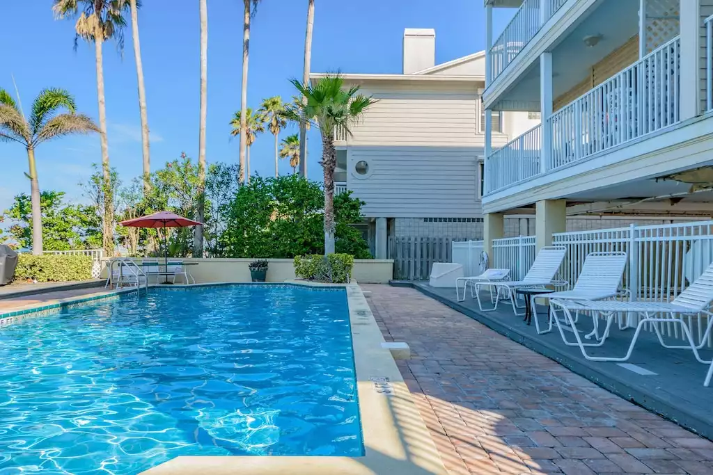 Beachside pool with Loungers, Tables, Chairs, & Grill.  Beach Access from Pool