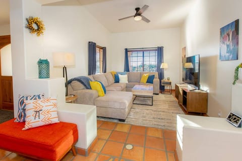 The living room on the first floor includes a 65 inch Roku smart TV along with a huge couch for movie nights.