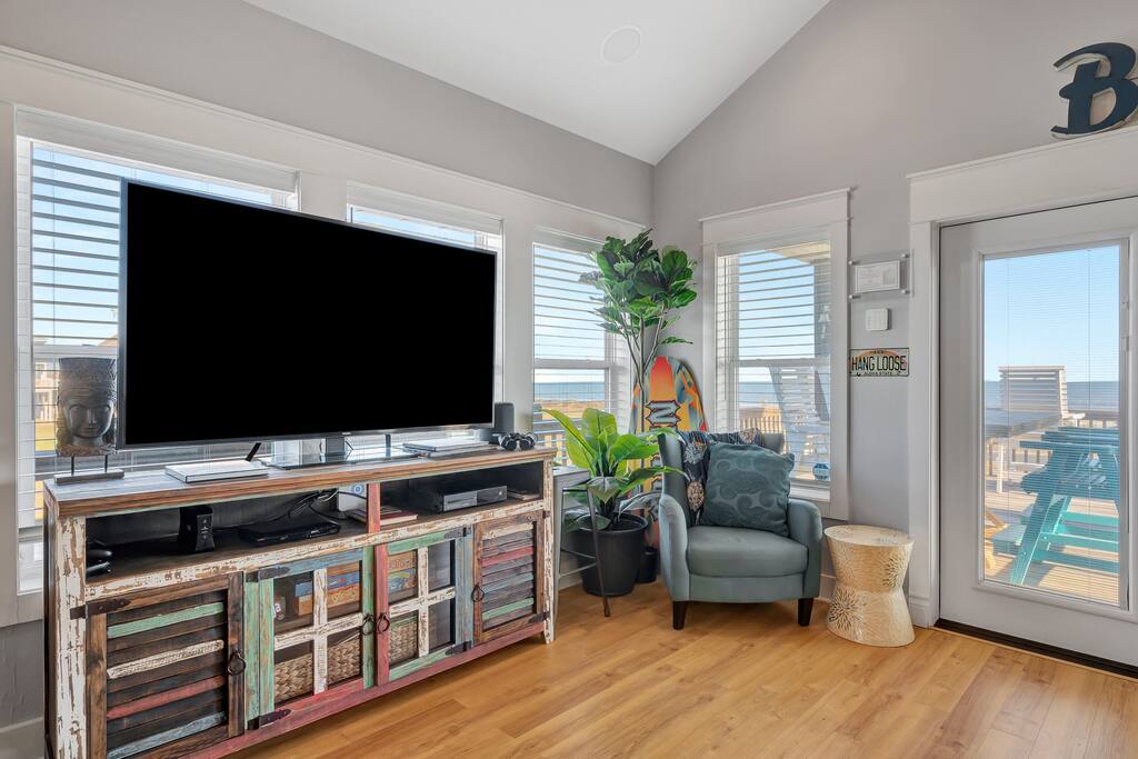 Living room with large smart tv and views of the beach! Gather here to make lifetime memories! - Crystal Beach - Lone Palm Resort - Bolivar Peninsula