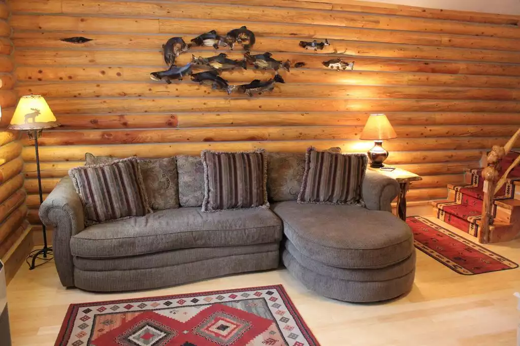 Cozy seating, with beautiful Alaskan handcrafted Salmon wall hanging!