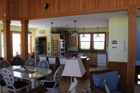 Another pic of great room, kitchen, and dining area.