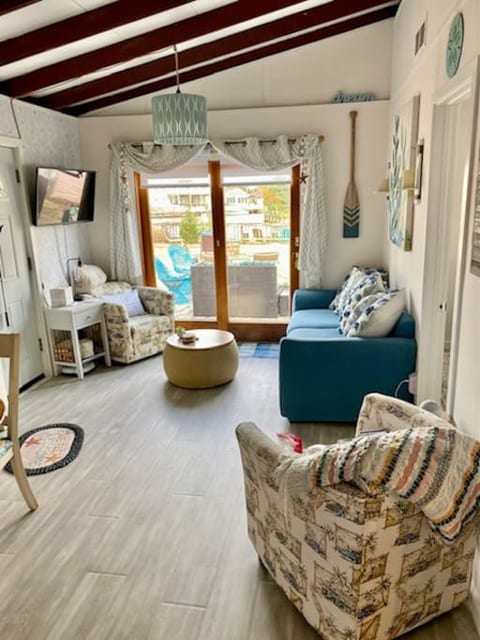 Open concept living area looks out to the water and gets lots of natural sunlight.