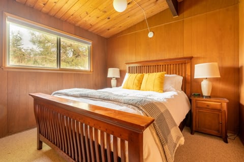 Guest bedroom 2 features a queen bed with premium bedding