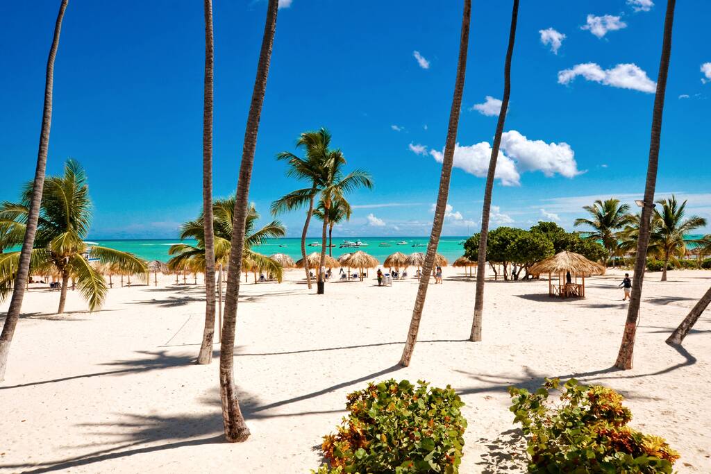 A large expanse of sand is ready for playtime, with plenty of palapas and loungers when you want to rest. - Luxury Condo with Stunning views, Private Beach - Punta Cana