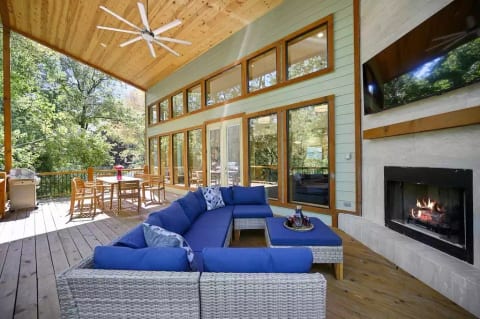 Gather in the back deck, with seating for outdoor dining and entertainment
