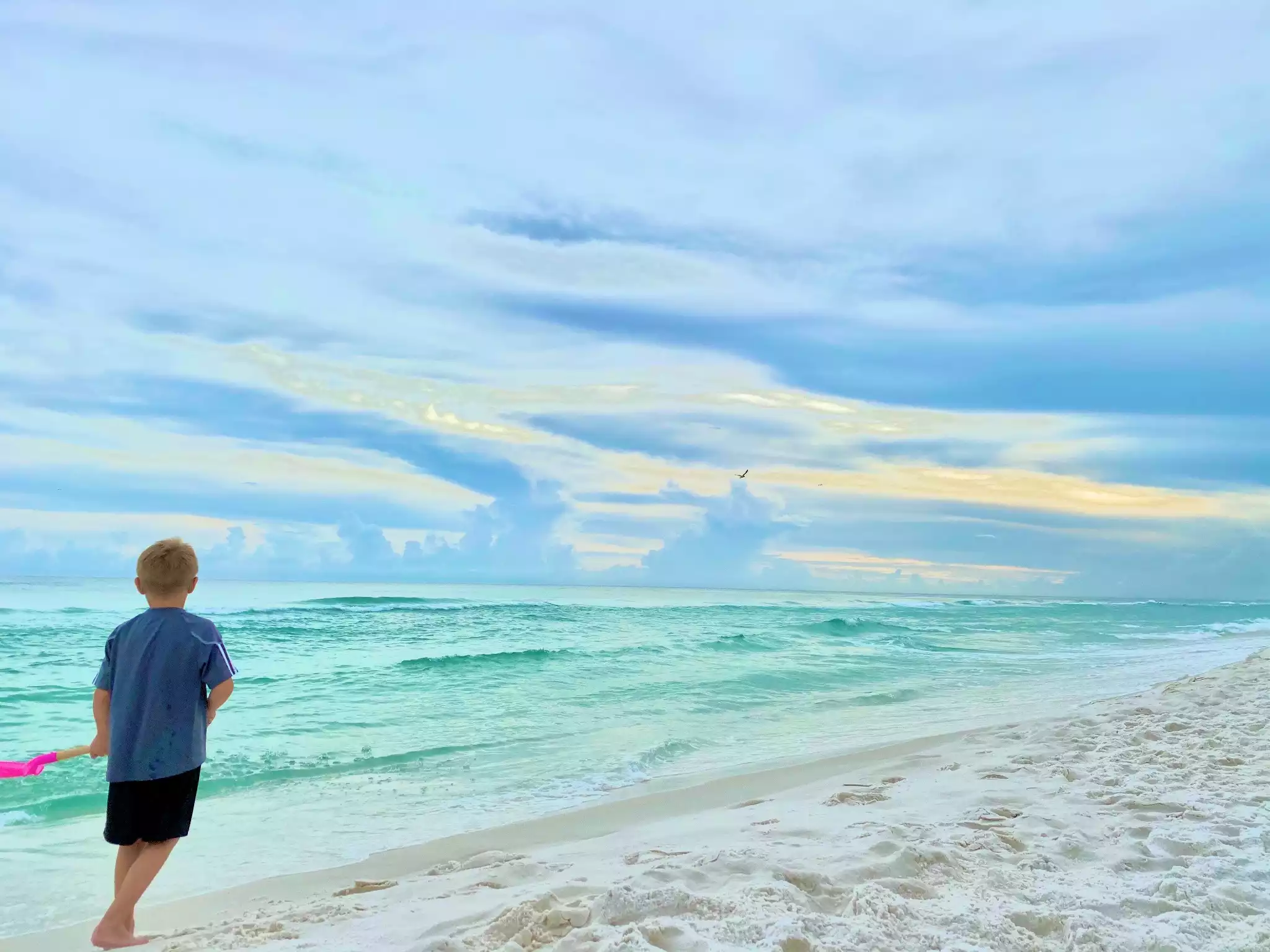 Emerald waters and pristine white sand surround the resort front