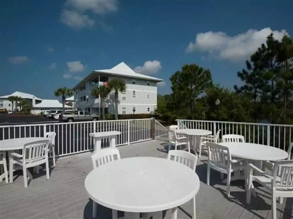 Picnic tables, grills and patio overlooking one of 3 lakes at Beachside Villas - Beachside Villas Unit 511 - Seagrove Beach