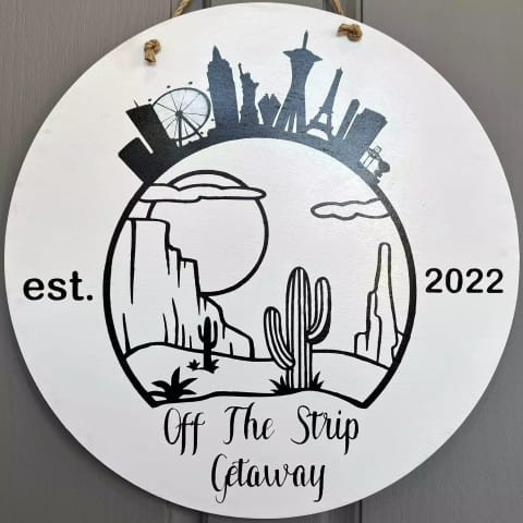 Our "Off The Strip Getaway" logo on the front door