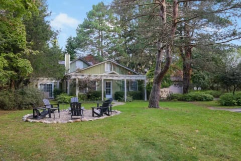 Front yard with wood burning fire pit