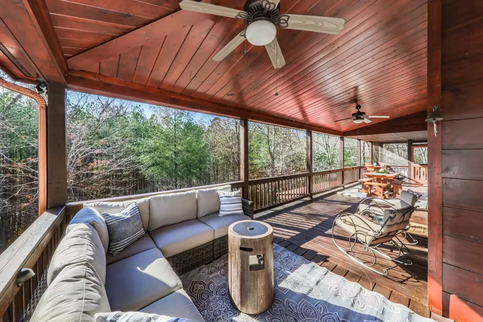 Sectional with glass rock firepit, overlooks the firepit in the yard & hot tub. The 6-seater outdoor dining table off the French doors with easy access to kitchen. - Aska Mountain Lodge  - Blue Ridge