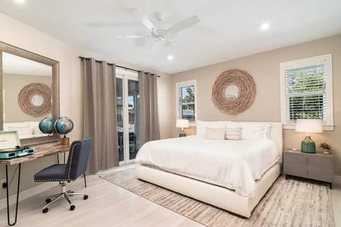 PRIMARY | Spacious room with king bed and workspace area