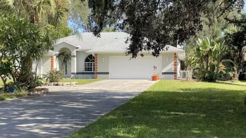 Front of the house tucked away in Florida greens