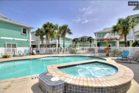 Sparkling pool and hot tub steps from the front door.